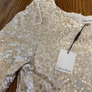 Calvin Klein cream/ gold sequined blouse. NWT